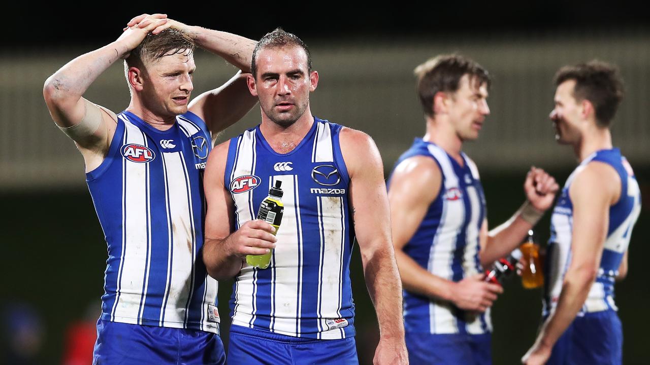 HOBART, AUSTRALIA - JUNE 19: Jack Ziebell (L) and Ben Cunnington (R) of the Kangaroos look dejected after the round 14 AFL match between the North Melbourne Kangaroos and the Brisbane Lions at Blundstone Arena on June 19, 2021 in Hobart, Australia. (Photo by Matt King/AFL Photos/via Getty Images)