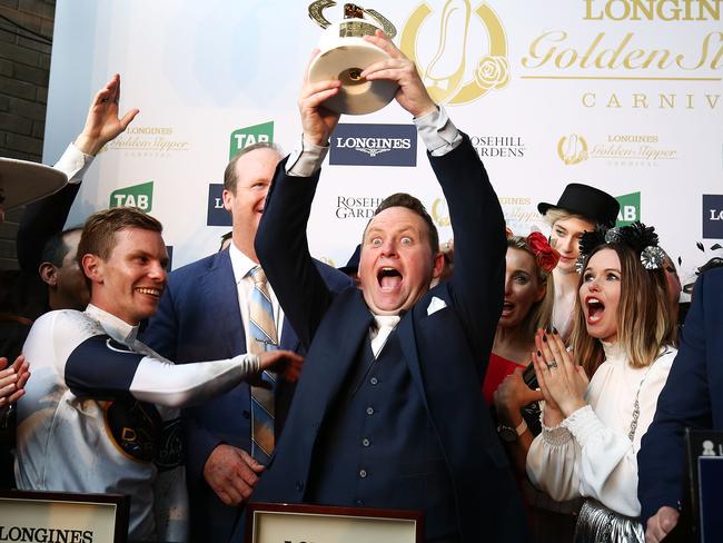 There’s going to be a party: Scott Darby and the winning connections lift the Golden Slipper after She Will Reign’s runaway victory. Picture: Getty Images