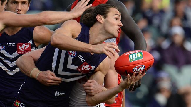 Lachie Weller gets a handball away. Picture: Daniel Wilkins