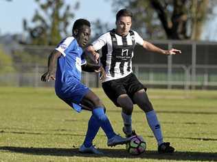 SPECIAL GAME: Rockville's David Oyori (left) and Willowburn's Mitchell Tanskey tussle for possession during last year's inaugural Jake Simpson Memorial Match. Picture: Kevin Farmer