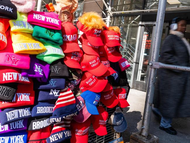 NEW YORK, NEW YORK - FEBRUARY 10: Hats supporting Donald Trump are displayed for sale in the Financial District Traders near the New York Stock Exchange (NYSE) on February 10, 2025 in New York City. Despite continued uncertainty with the Trump administration's proposed tariffs, stocks were up over 100 points in afternoon trading.   Spencer Platt/Getty Images/AFP (Photo by SPENCER PLATT / GETTY IMAGES NORTH AMERICA / Getty Images via AFP)