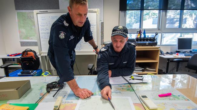 Sergeant Anthony Dessent maps out the search area. Picture: Jason Edwards