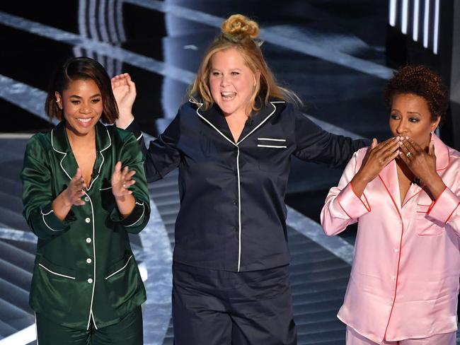 Regina Hall, Amy Schumer and Wanda Sykes hosted the 2022 Oscars. Picture: Robyn Beck / AFP)