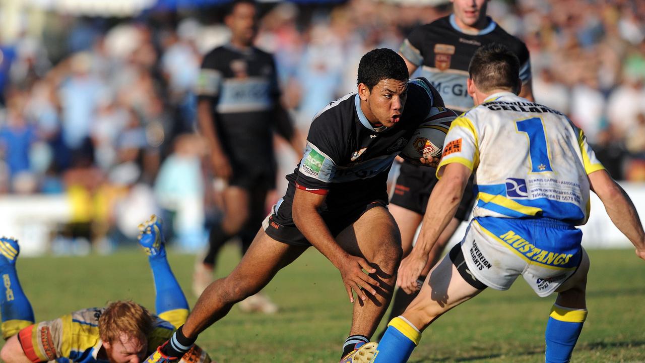 A young Brian Kelly charges through Murwillumbah’s defence for the Ballina Seagulls