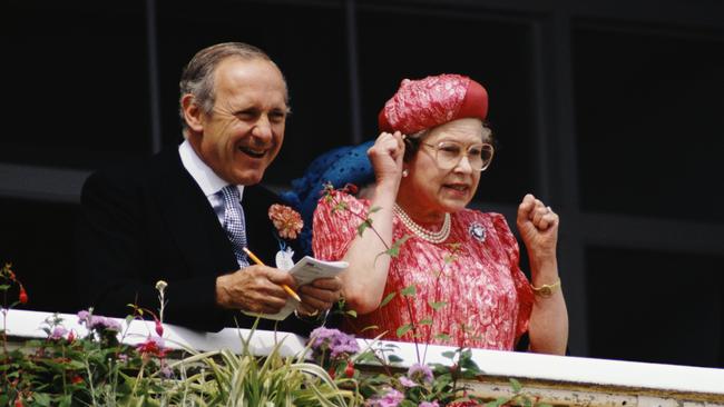 Sir William and the Queen at Epsom for the Derby in 1989. Picture: Getty Images