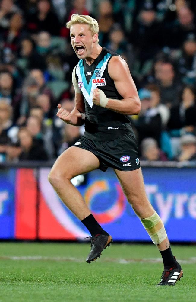 Billy Frampton of the Power celebrates his first AFL goal. Picture: AAP Image/Kelly Barnes