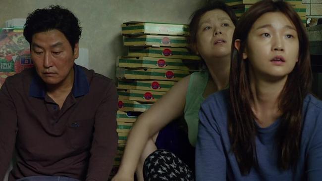 Song Kang-ho, Jang Hye-jin and Park So-dam in a scene from Parasite. Picture: Neon via AP