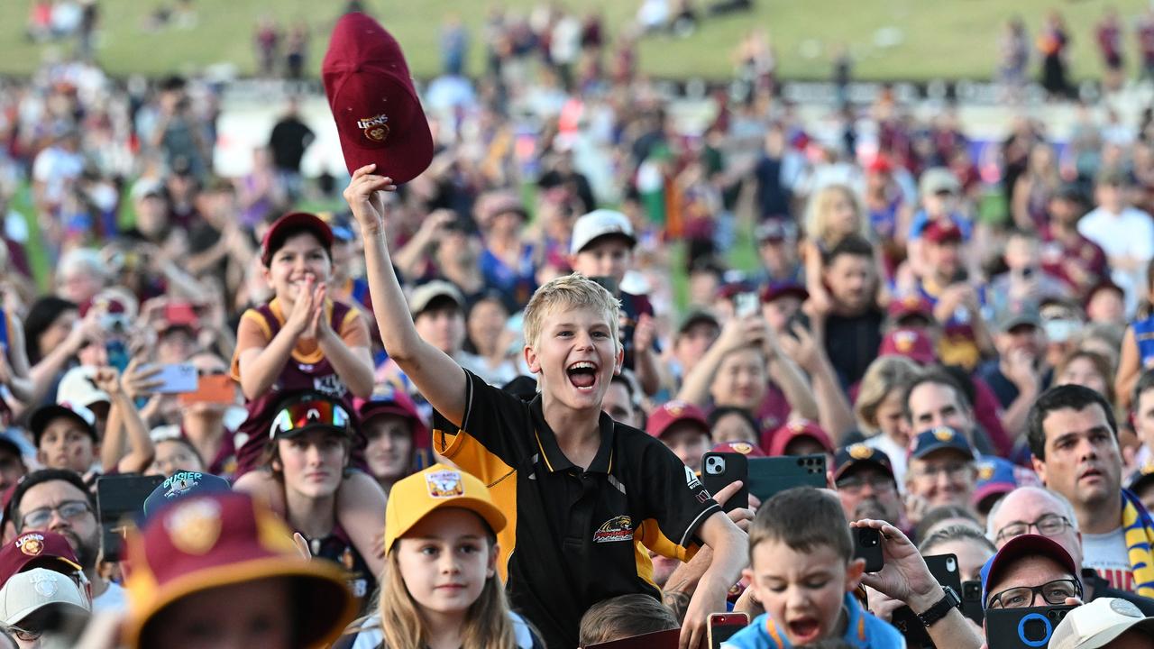 IPSWICH, AUSTRALIA - SEPTEMBER 29: Fans celebrate at Brighton Homes Arena, on September 29, 2024, in Ipswich, Australia. The Brisbane Lions won the 2024 AFL Grand Final yesterday beating Sydney Swans at the MCG. (Photo by Bradley Kanaris/Getty Images)