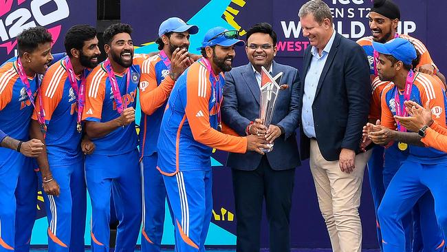 Incoming ICC chair Jay Shah, centre, with current boss Greg Barclay after the Indian team won the T20 World Cup in Barbados in June Picture: AFP