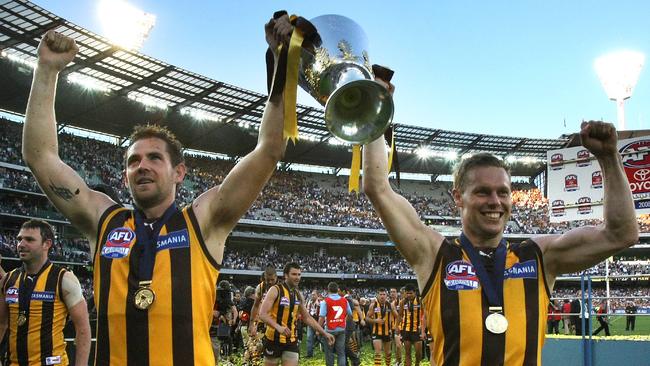 Luke Hodge and Sam Mitchell hold up the premiership cup in 2008. Picture: Stuart McEvoy