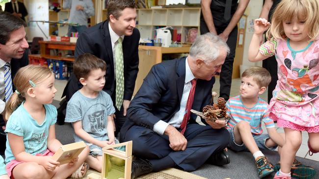 Prime Minister Malcolm Turnbull at a Plympton childcare centre with Simon Birmingham and Matt Williams. Photo Naomi Jellicoe