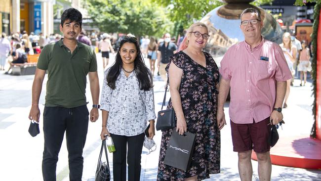 Shoppers Dhruvin Mehta, Kruti Shah, Bronwyn Cousins and her husband Mark Cousins in Rundle Mall on December, 12. Picture: Mark Brake