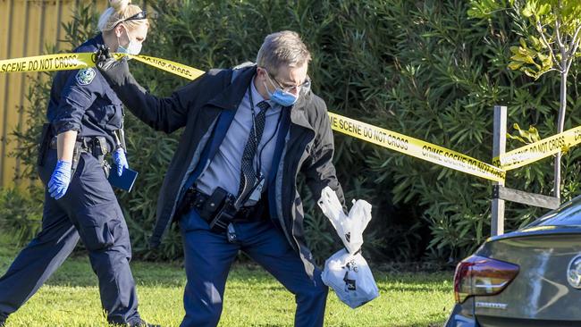 Detectives and officers at the scene of the Port Noarlunga stabbing. Picture: Roy VanDerVegt