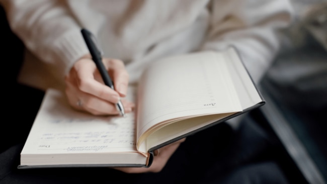 Mindful activities well before bed time, such as journaling or reading, can help relax our subconscious and improve out sleep quality. Image: Getty