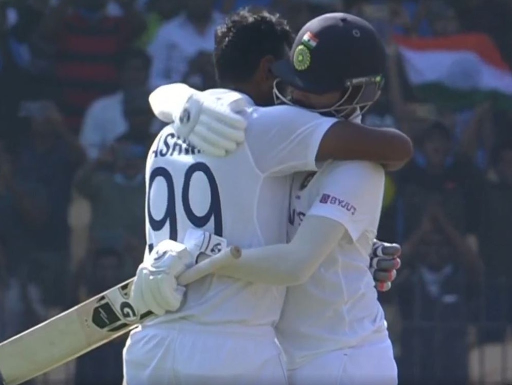Ravichandran Ashwin embraces teammate Mohammed Siraj.