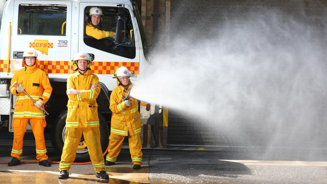 Volunteers from the Belair CFS Lachlan Painter, James Wilson Bobbie Rice and Joff Medder in the truck prepare for a hot week. Picture: Tait Schmaal