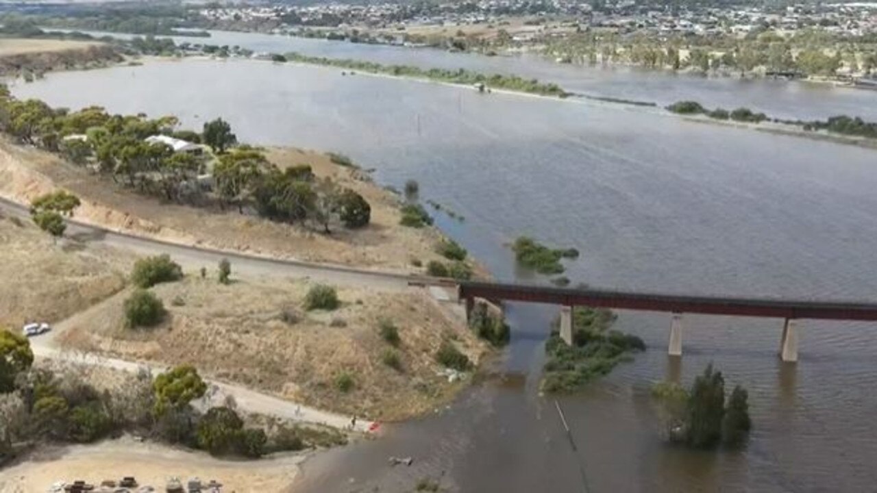 Water completely engulfing dairy flats next to the river in Murray Bridge. Picture: Mark Pearsons