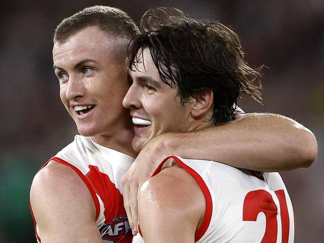 Sydney's Chad Warner and Errol Gulden celebrate setting up a goal to Logan McDonald during the Round 1 AFL match between the Collingwood Magpies and the Sydney Swans at the MCG on March 15, 2024. Photo by Phil Hillyard(Image Supplied for Editorial Use only - Phil Hillyard  **NO ON SALES** - Â©Phil Hillyard )