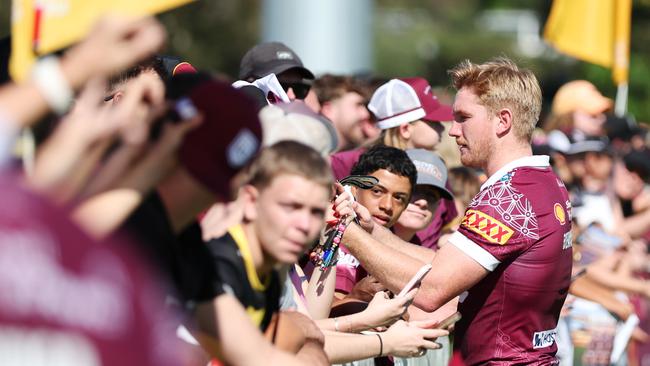 Tom Dearden signs autographs with Queensland fans. Picture Lachie Millard