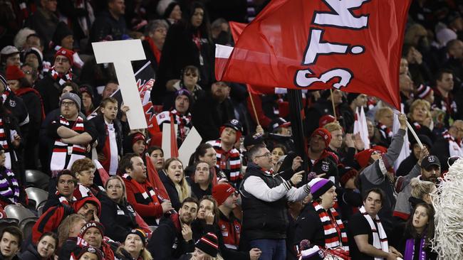 Swinburne University surveyed thousands of AFL followers and uncovered a previously hidden group of diehard fans who pay to support their team but follow their season from home.