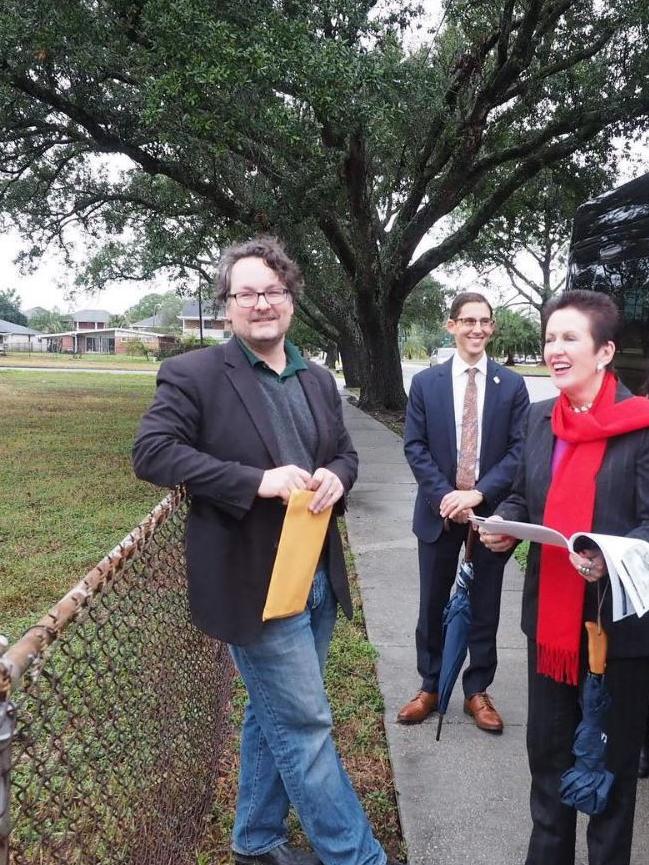 Inspecting a fence in New Orleans.