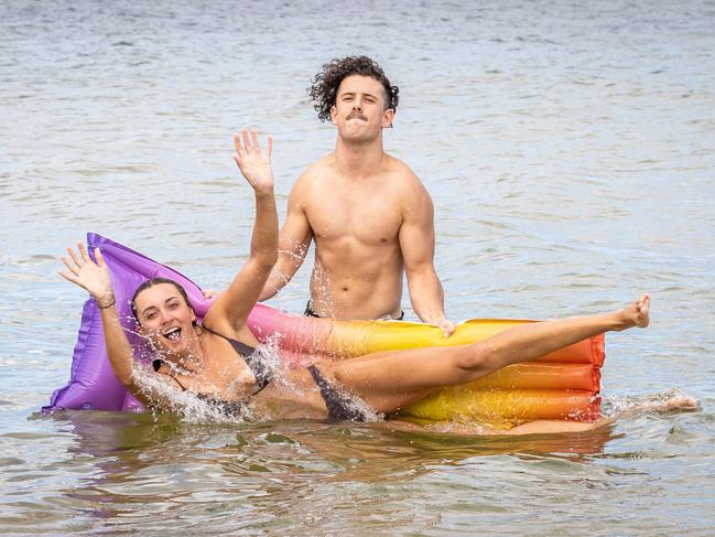 Rosie Peddie and Alp Semiz cool off at Brighton Beach. Picture: Jake Nowakowski