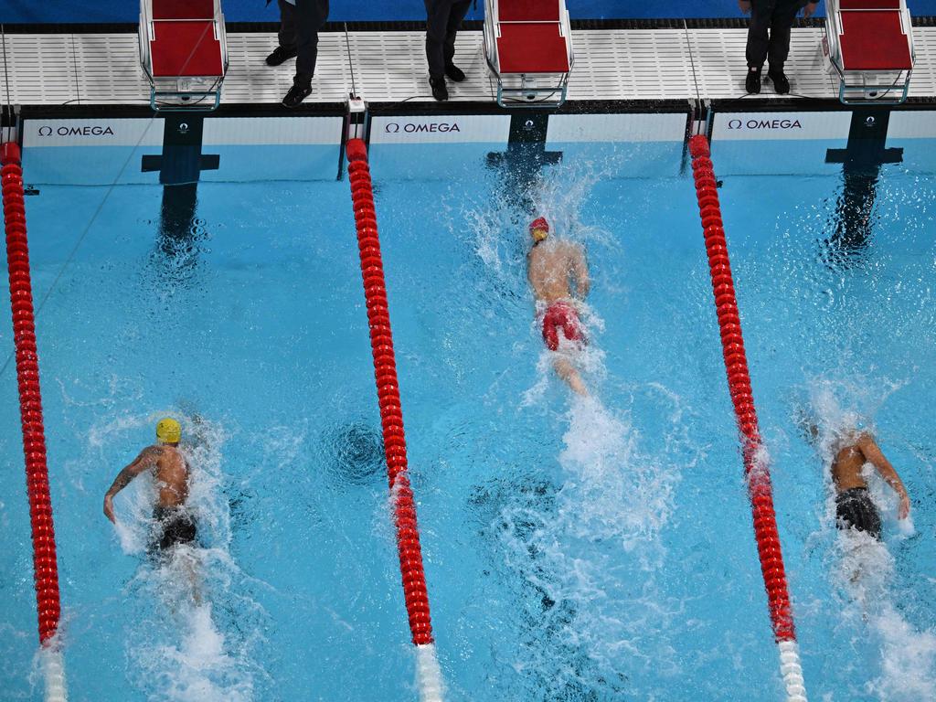 An overview shows China's Pan Zhanle (C), Australia's Kyle Chalmers (L) and Romania's David Popovici competing in the final of the 100m freestyle in Paris. Picture: AFP