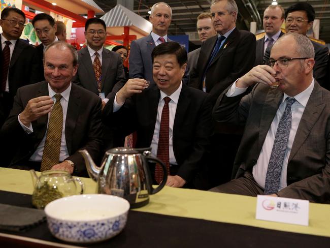 SA Trade Minister Martin Hamilton-Smith, Shandong Party Secretary Jiang Yikang and SA Tourism Minister Leon Bignell have tea while they inspect the Shandong exhibit at the Royal Adelaide Show.