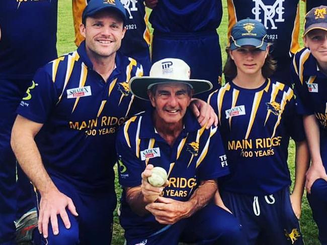 Lloyd Hosking, with the ball, is surrounded by his Main Ridge teammates after taking his 500th wicket. Picture: Facebook