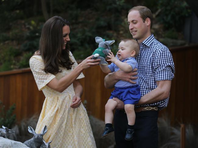 On tour ... Catherine, the Duchess of Cambridge hands Prince George a toy Bilby given to him as a gift by Tarong Zoo while being held by his father Prince William, Duke of Cambridge. Picture: Kate Geraghty/Fairfax Media