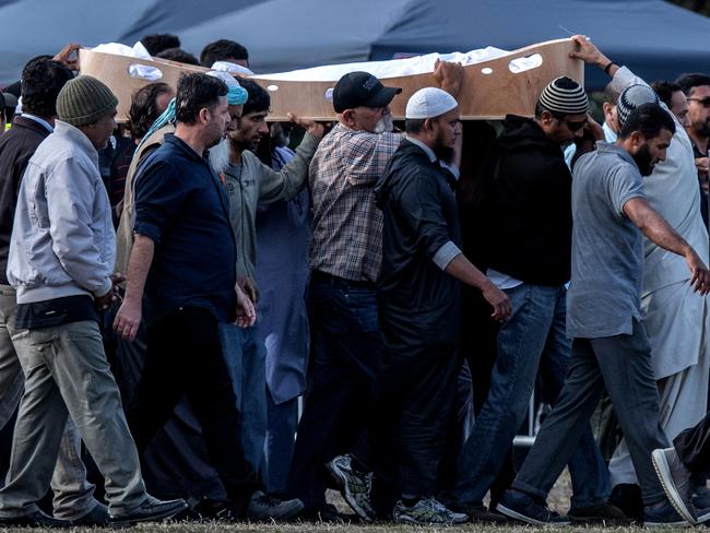 A coffin containing the body of a victim of the Christchurch terrorist attack is carried for burial at Memorial Park Cemetery. Picture: Getty Images