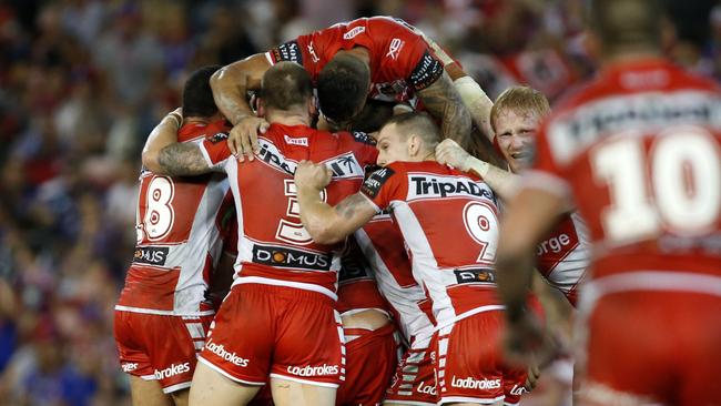 Dragons players celebrate winning against the Knights after Corey Norman kicked a golden point field goal. Picture: AAP