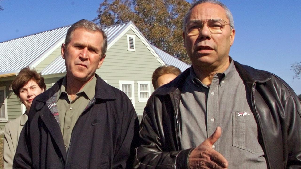 Gen. Colin Powell, right, joins then Texas Gov. George W. Bush at Bush's central Texas ranch near Crawford in 2000.