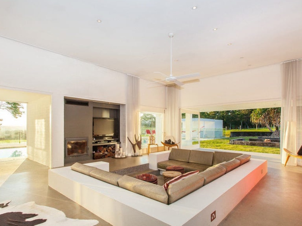 What&amp;#39;s more romantic than a sunken lounge by a fireplace in a love nest? Picture: Supplied