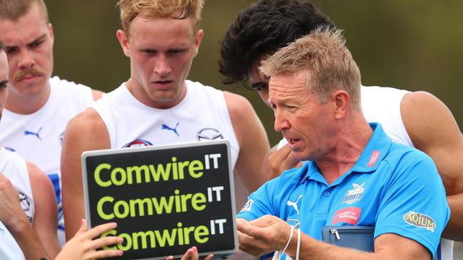 Kangaroos coach David Noble speaks to players duringa break of a practice match against Melbourne at Casey Fields in February 2022. Picture: GETTY IMAGES