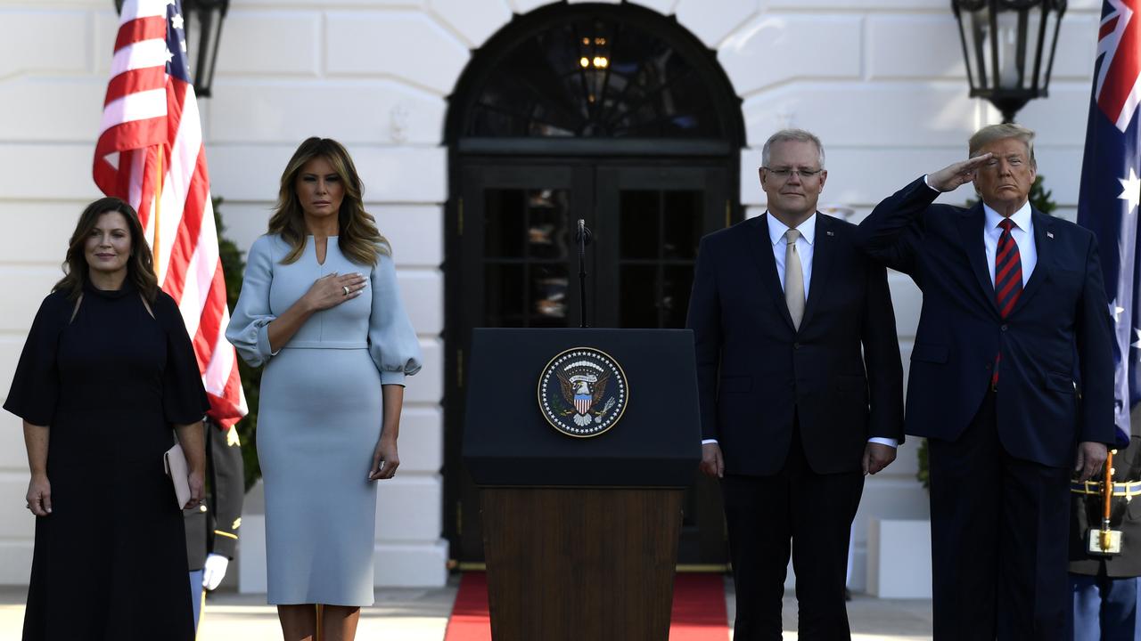 US President Donald Trump and first lady Melania Trump stand for the US National Anthem with Australian Prime Minister Scott Morrison and his wife Jenny Morrison. Picture: AP/ Susan Walsh.