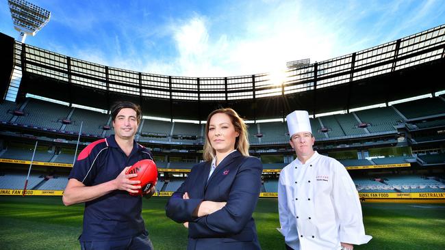 MCG groundskeeper Michael Salvatore, security staffer Lidija Stosic and head chef Travis Dines. They’re just some of the small army ensuring the MCG is ready to shine on grand final day. Picture: Nicki Connolly