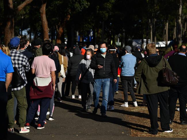 People queue at a vaccination hub at Sydney’s Olympic Park. Picture: NCA NewsWire/Joel Carrett