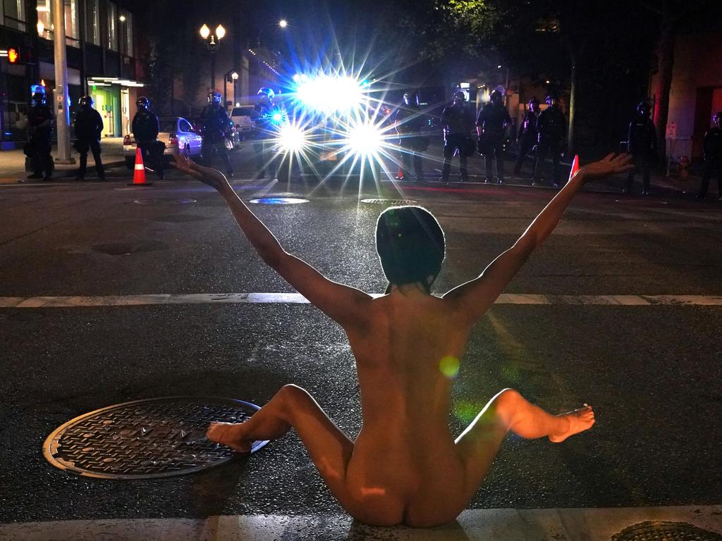 A nude female protester put on a stark display in front of police during a BLM rally in Portland, Oregon in the US on Friday night. Picture: REUTERS/Nathan Howard