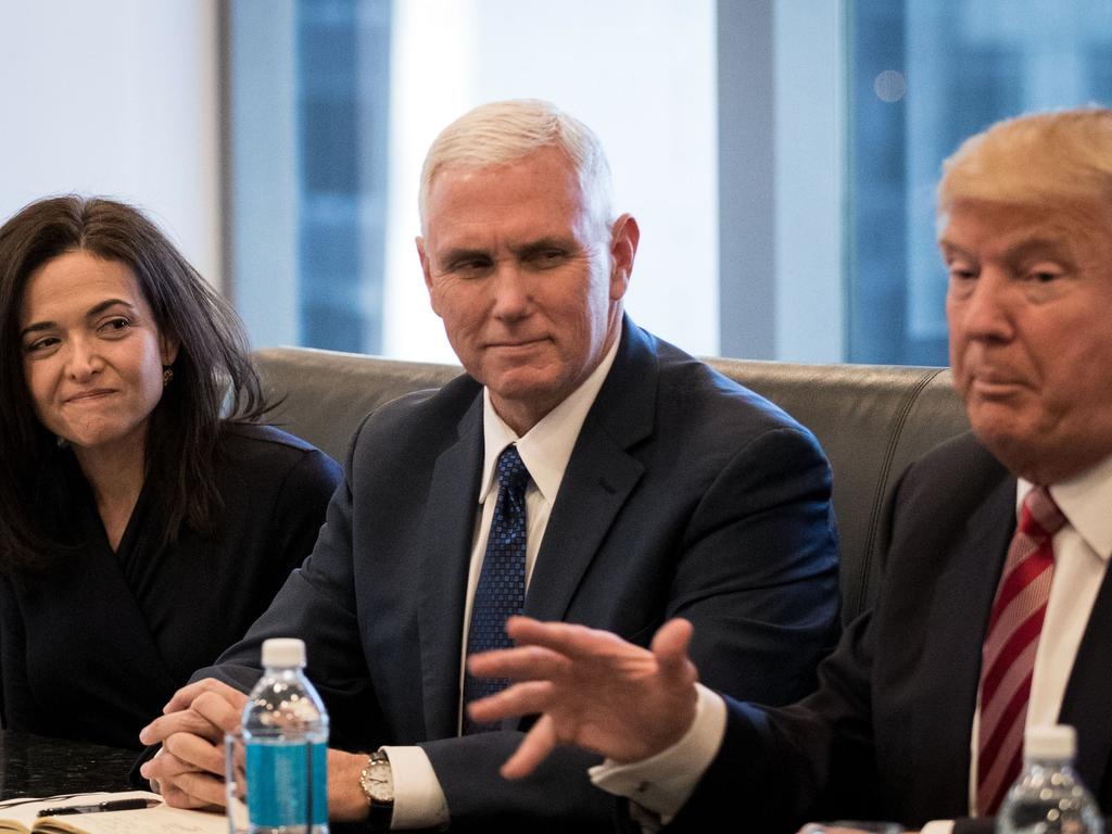 Sheryl Sandberg with Vice President Mike Pence and President Donald Trump at a meeting of technology executives. Picture: Getty, AFP