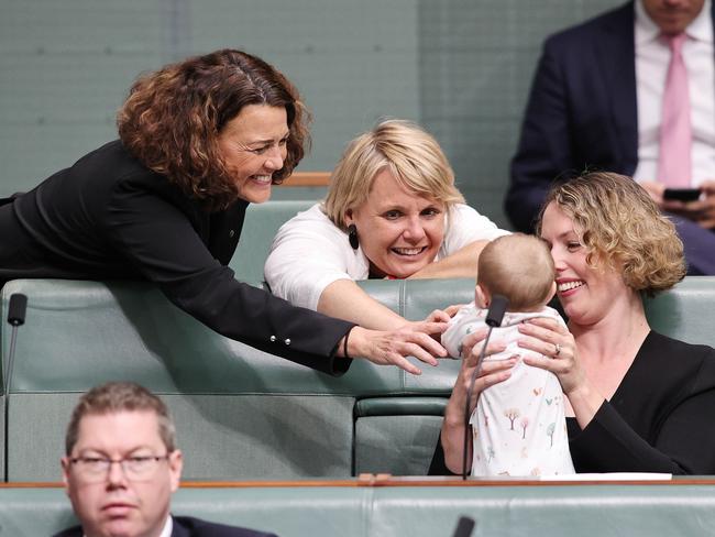 Alicia Payne shows off her new born in the House of Representatives. Picture: Gary Ramage