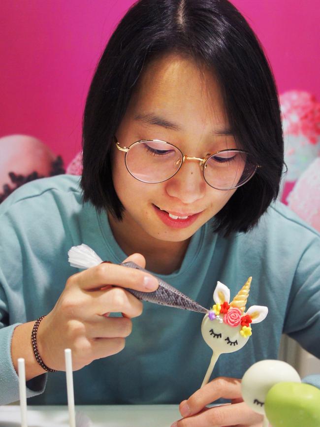 Jeslyn Pal decorates cake pop unicorns and princesses from Sugar Pop Bakery.