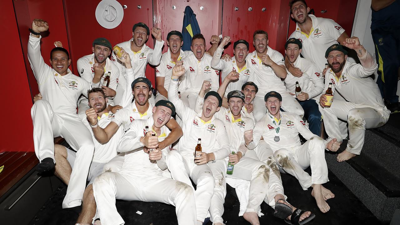Australia’s players celebrate in the dressing room after retaining the Ashes.