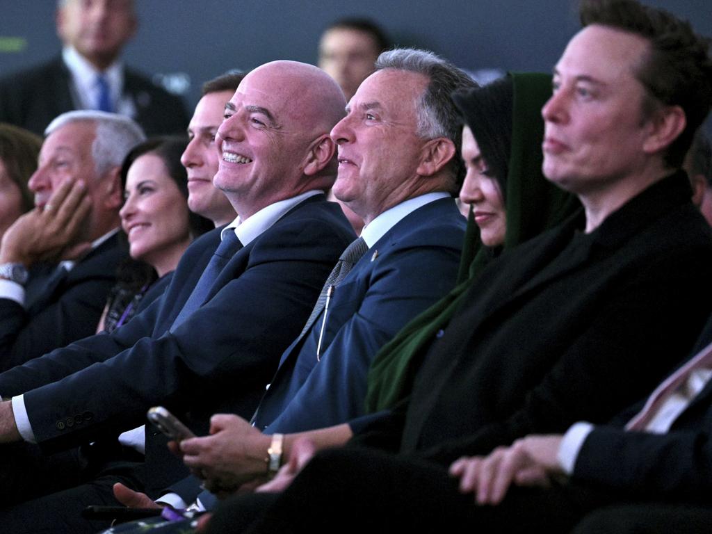 FILE – From right, Elon Musk, U.S. special envoy to the Middle East Steve Witkoff, FIFA President Gianni Infantino and Jared Kushner listen as President Donald Trump speaks at the Future Investment Initiative (FII) Institute summit in Miami Beach, Fla., Feb. 19, 2025. (Pool via AP)