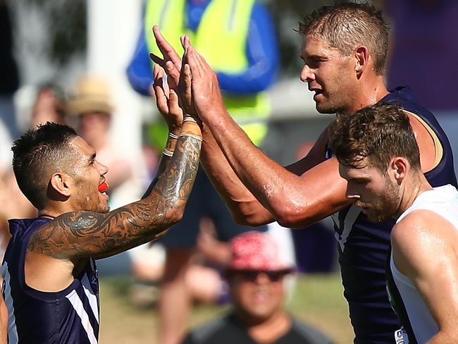 PERTH, AUSTRALIA - MARCH 04: Michael Walters and Aaron Sandilands of the Dockers celebrate a goal during the 2017 JLT Community Series AFL match between the Fremantle Dockers and the Collingwood Magpies at Rushton Park on March 4, 2017 in Perth, Australia. (Photo by Paul Kane/Getty Images)