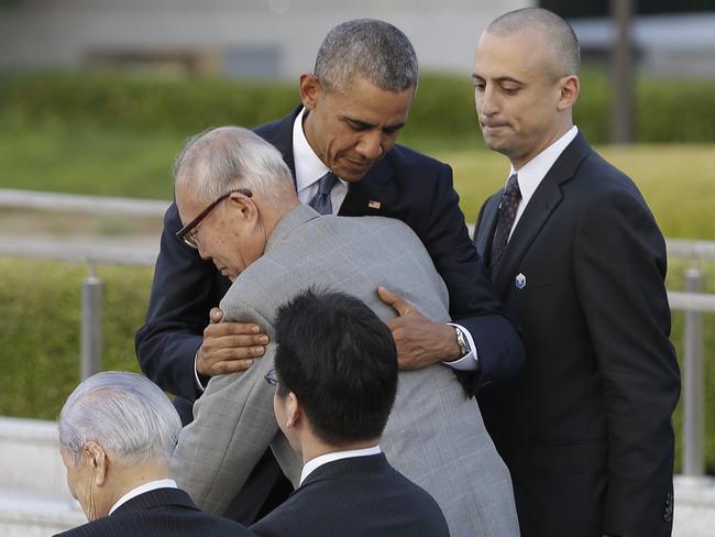 U.S. President Barack Obama hugs Shigeaki Mori, an atomic bomb survivor and a creator of the memorial for American WWII POWs killed in Hiroshima, during a ceremony at Hiroshima Peace Memorial Park in Hiroshima, western, Japan, Friday, May 27, 2016. Obama on Friday became the first sitting U.S. president to visit the site of the world's first atomic bomb attack, bringing global attention both to survivors and to his unfulfilled vision of a world without nuclear weapons. (AP Photo/Carolyn Kaster)