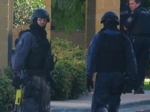 Armed police at the scene. Pictures: Toby Vue