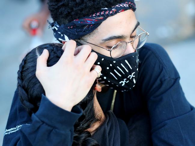 Two protesters embrace during a demonstration in response to the death of African-American George Floyd at the hands of Minneapolis, Minnesota police. Picture: AFP