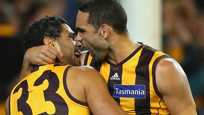 Cyril Rioli and Shaun Burgoyne helped the Hawks break the Kennett Curse in the 2013 preliminary final/ Picture: Getty Images