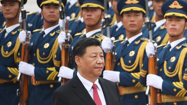 Chinese President Xi Jinping walks past a military honour guard in Beijing. Picture: AFP